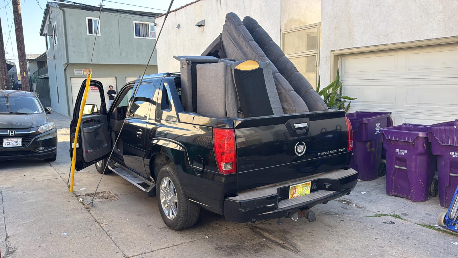Couch and large furniture loaded on truck for removal
