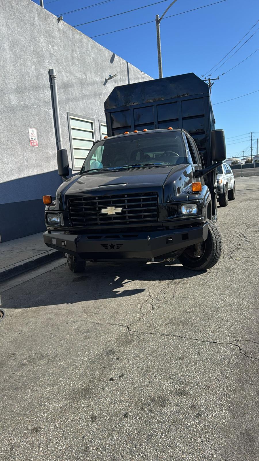 Front view of Pepe's Haulin black hauling truck